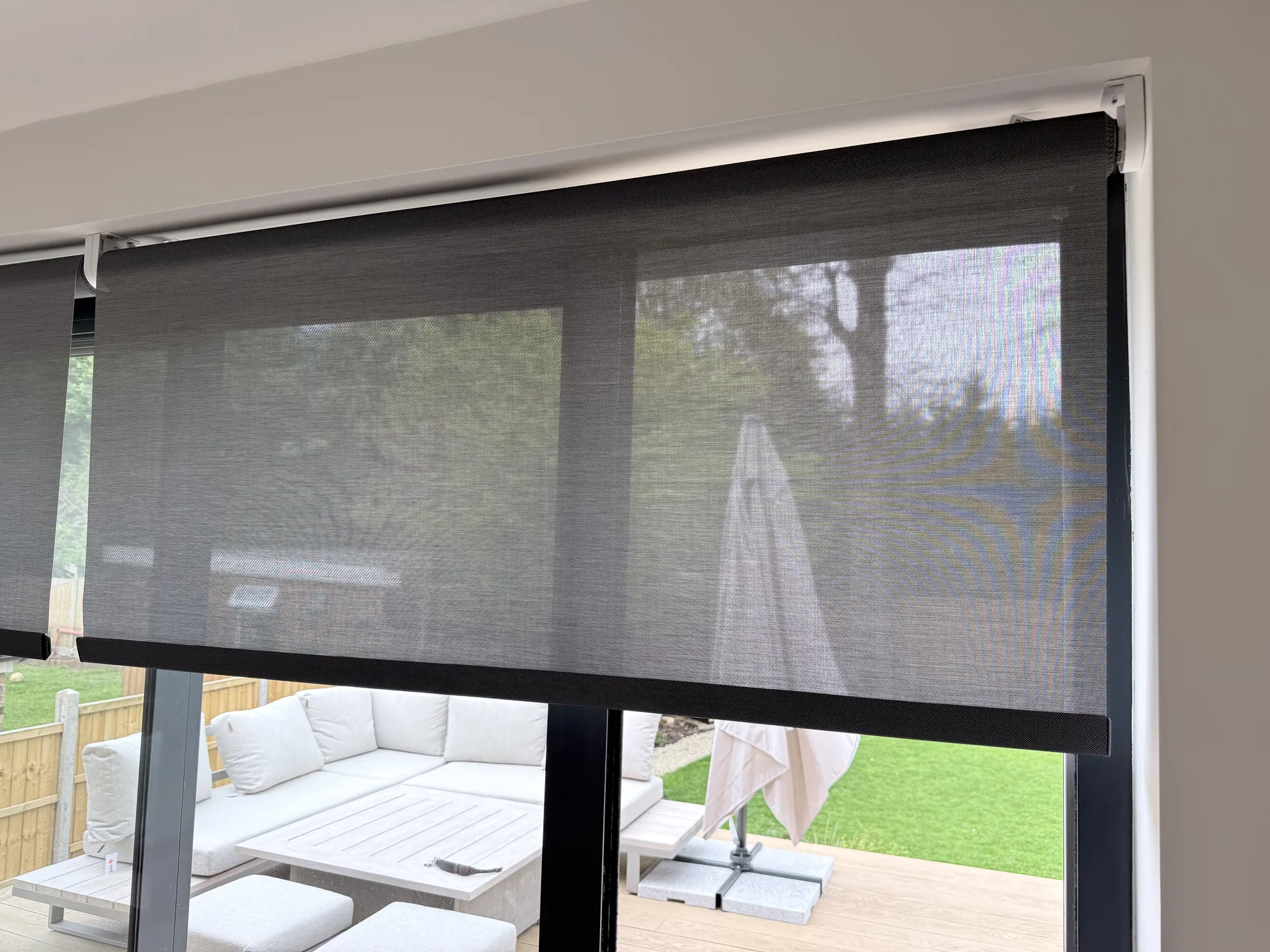 Motorised roller blinds and automated shading in a contemporary living room